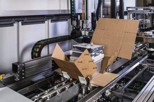 A cardboard box on a conveyor belt